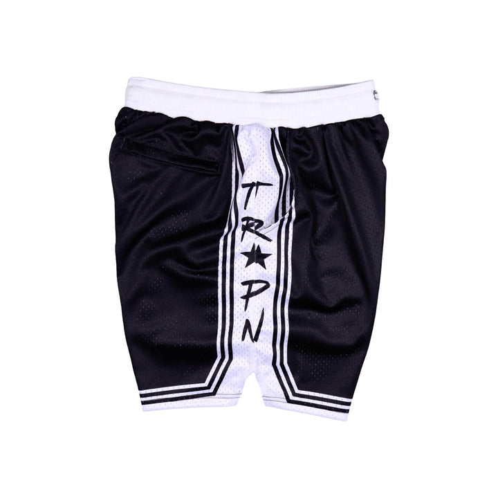 Other side view of Black shorts with white accents on a white background