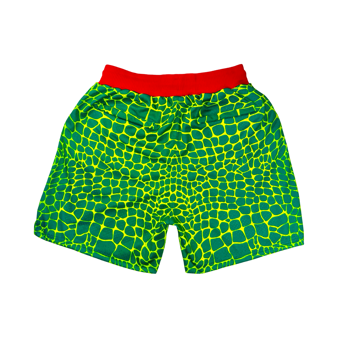 Trap Grinch Mesh Pro basketball shorts with neon green reptile pattern, red pro waistband, and zippered pockets by Trap’N Shorts.