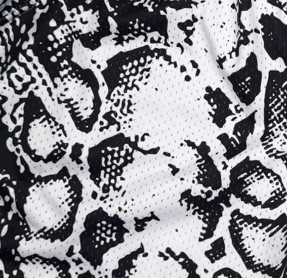 White mesh snakeskin pattern basketball shorts texture closeup