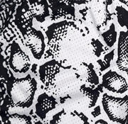 White mesh snakeskin pattern basketball shorts texture closeup