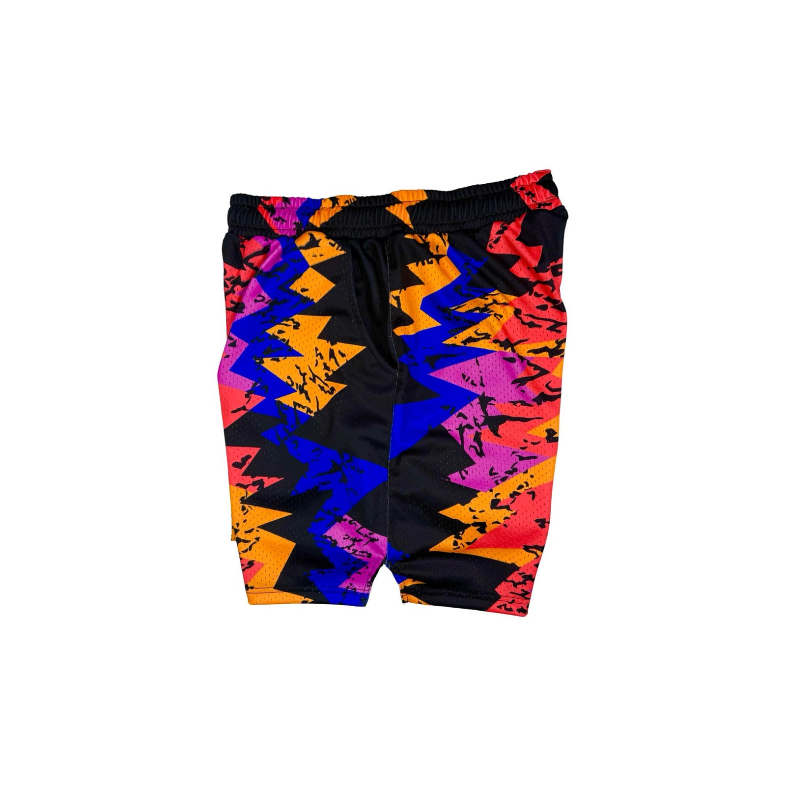 Colorful geometric patterned shorts on a white background