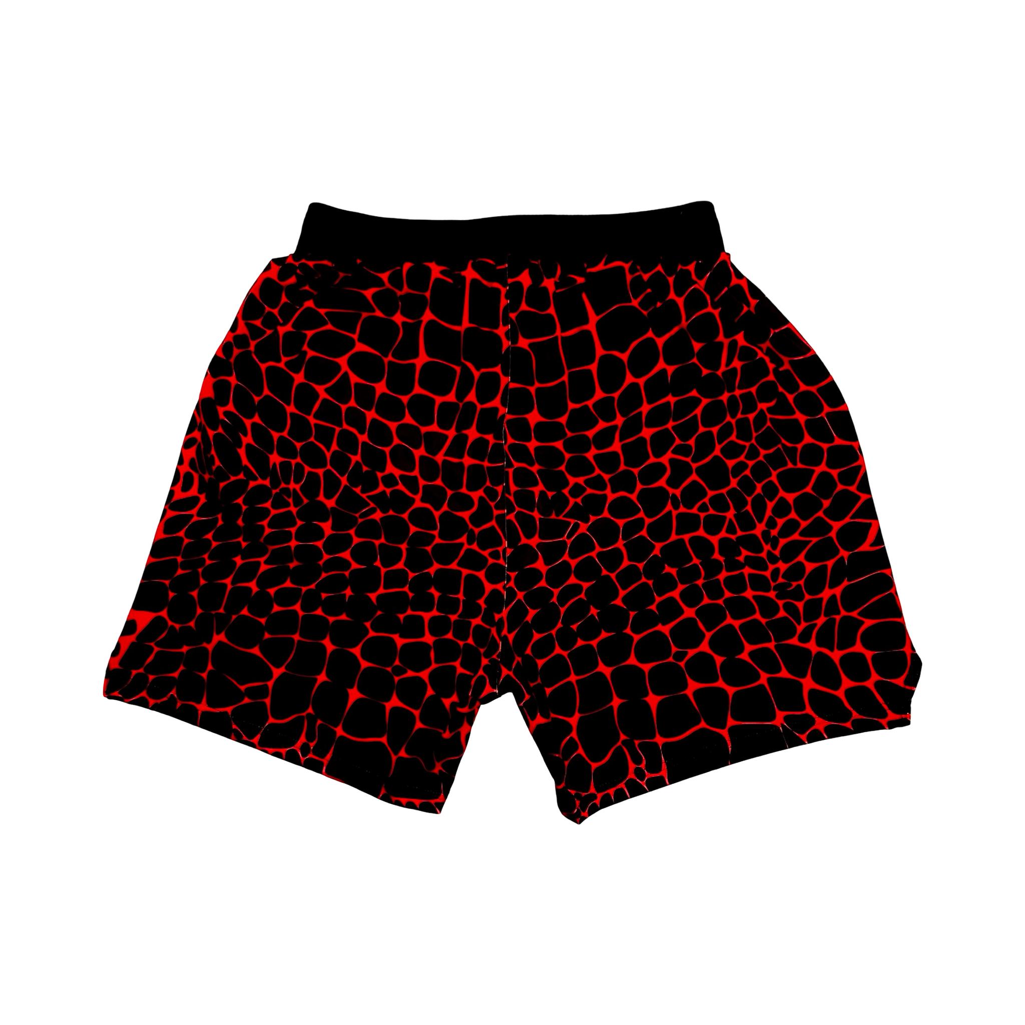 Red and black gator/zombie patterned shorts on a white background