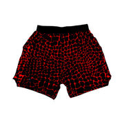 Red and black gator/zombie patterned shorts on a white background