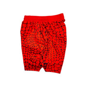 Red shorts with black gator/zombie pattern on a white background