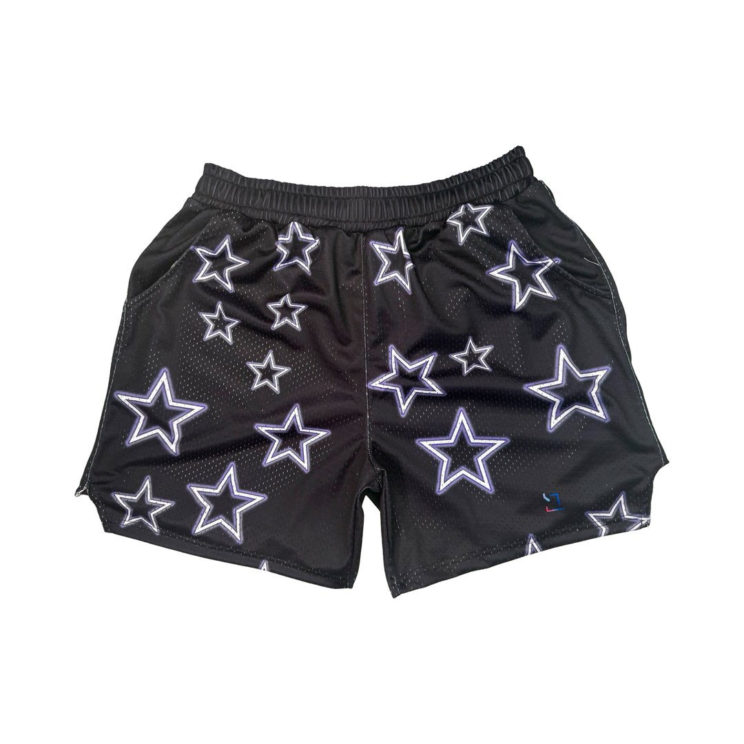 Black shorts with white star patterns on a black background