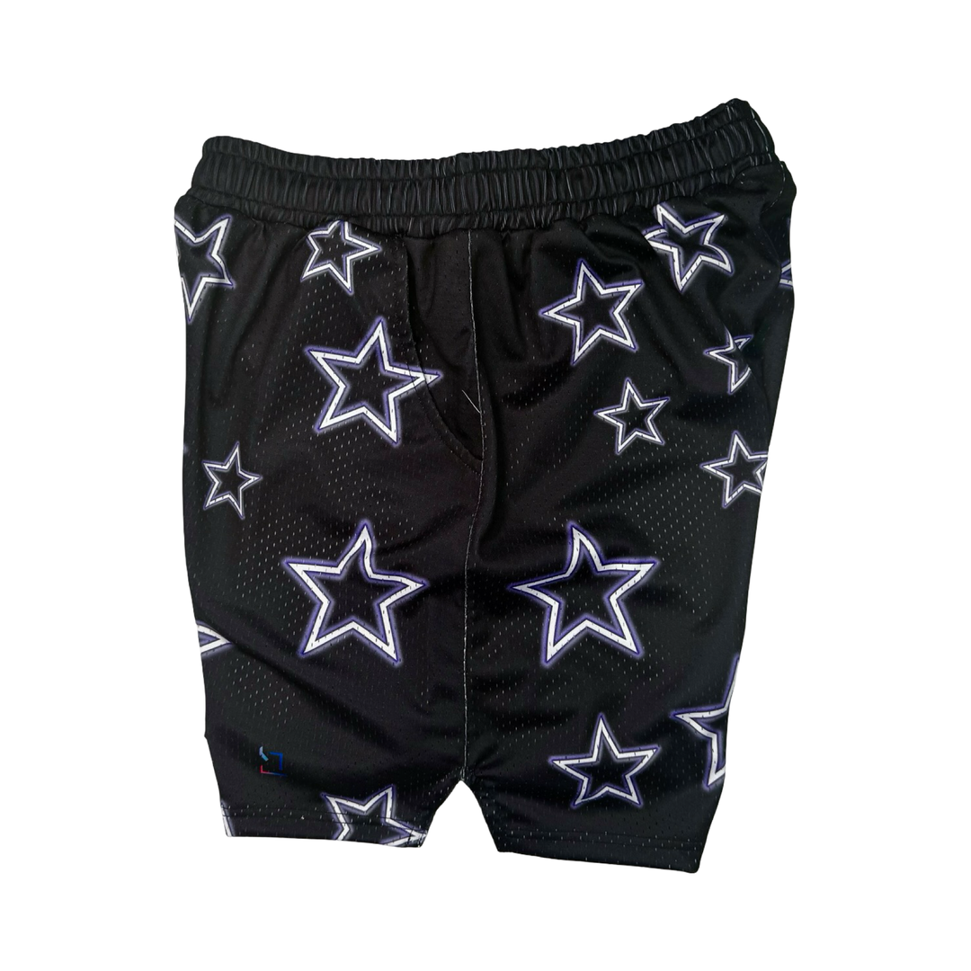 Black shorts with star patterns on a black background