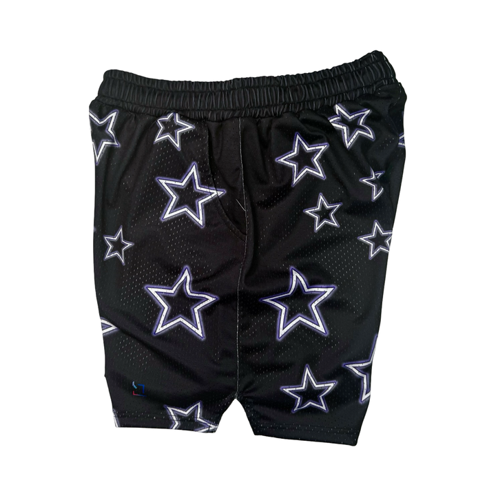Black shorts with star patterns on a black background