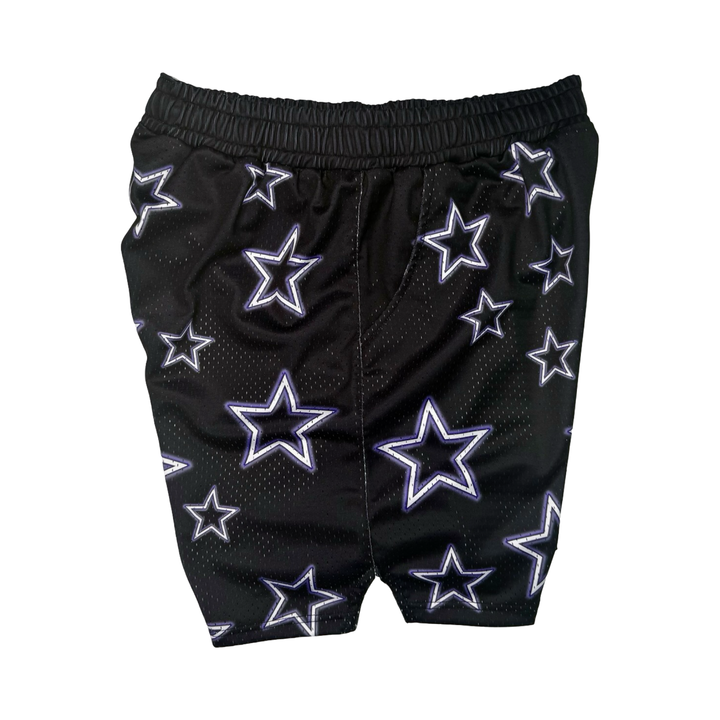 Black shorts with star patterns on a black background