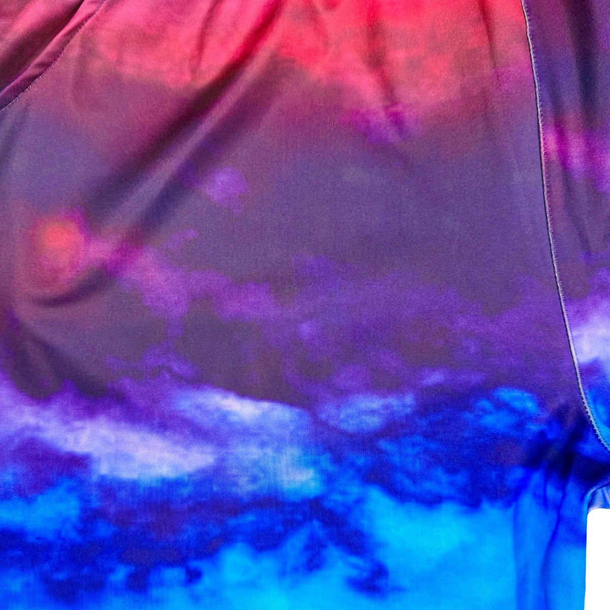 Colorful  pink blue and purple gradient see shore shorts closeup