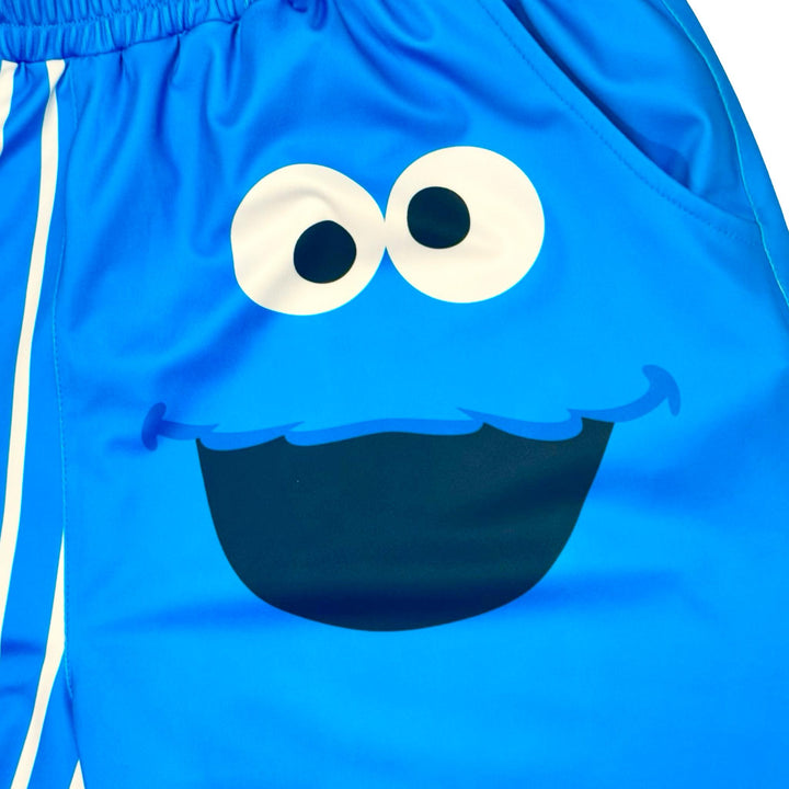 Blue shorts with a smiley face monster character design texture closeup