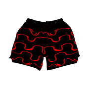 Black shorts with red wavy drip patterns on a white background