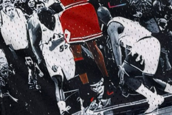 Shorts with a black and white vintage game winner photo design featuring a basketball player in action close up texture.