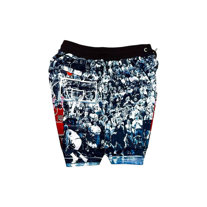 Black white and red shorts with a basketball player taking a historic game winning shot