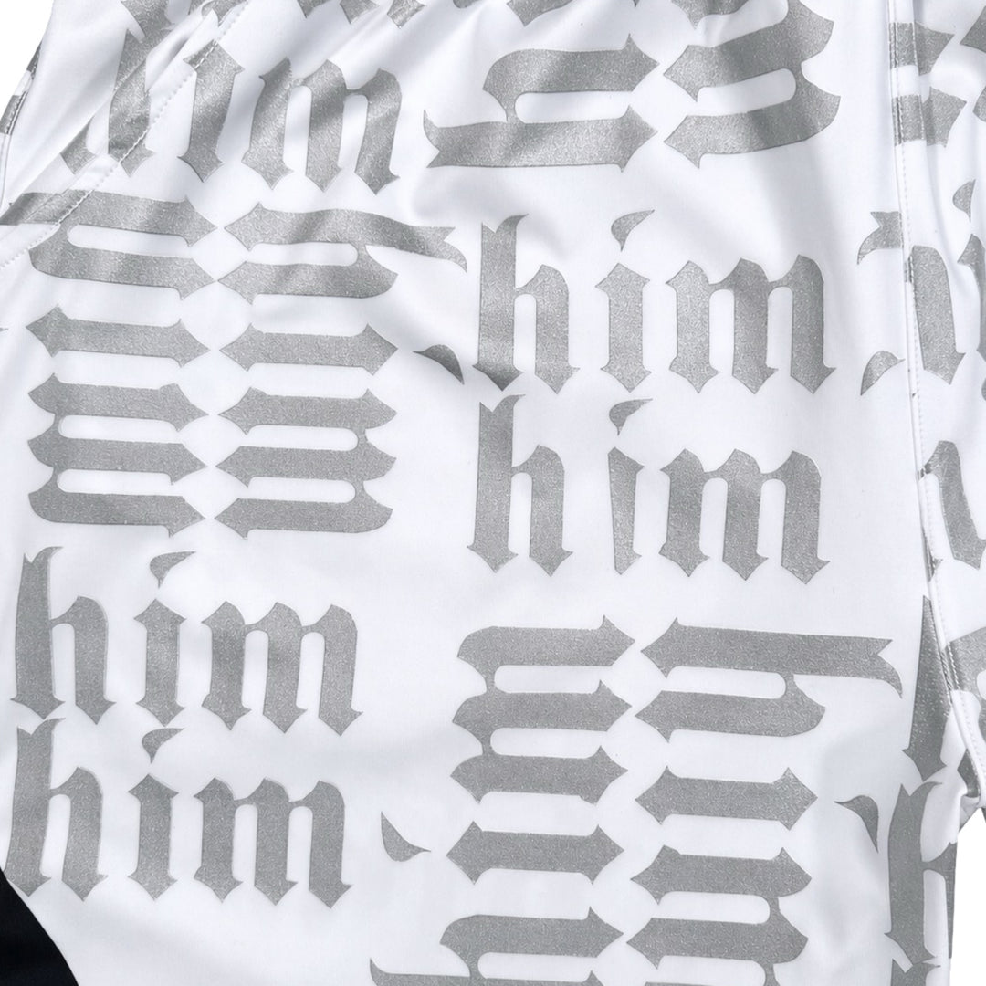 White silver and black him shorts with silver text pattern and black trim closeup
