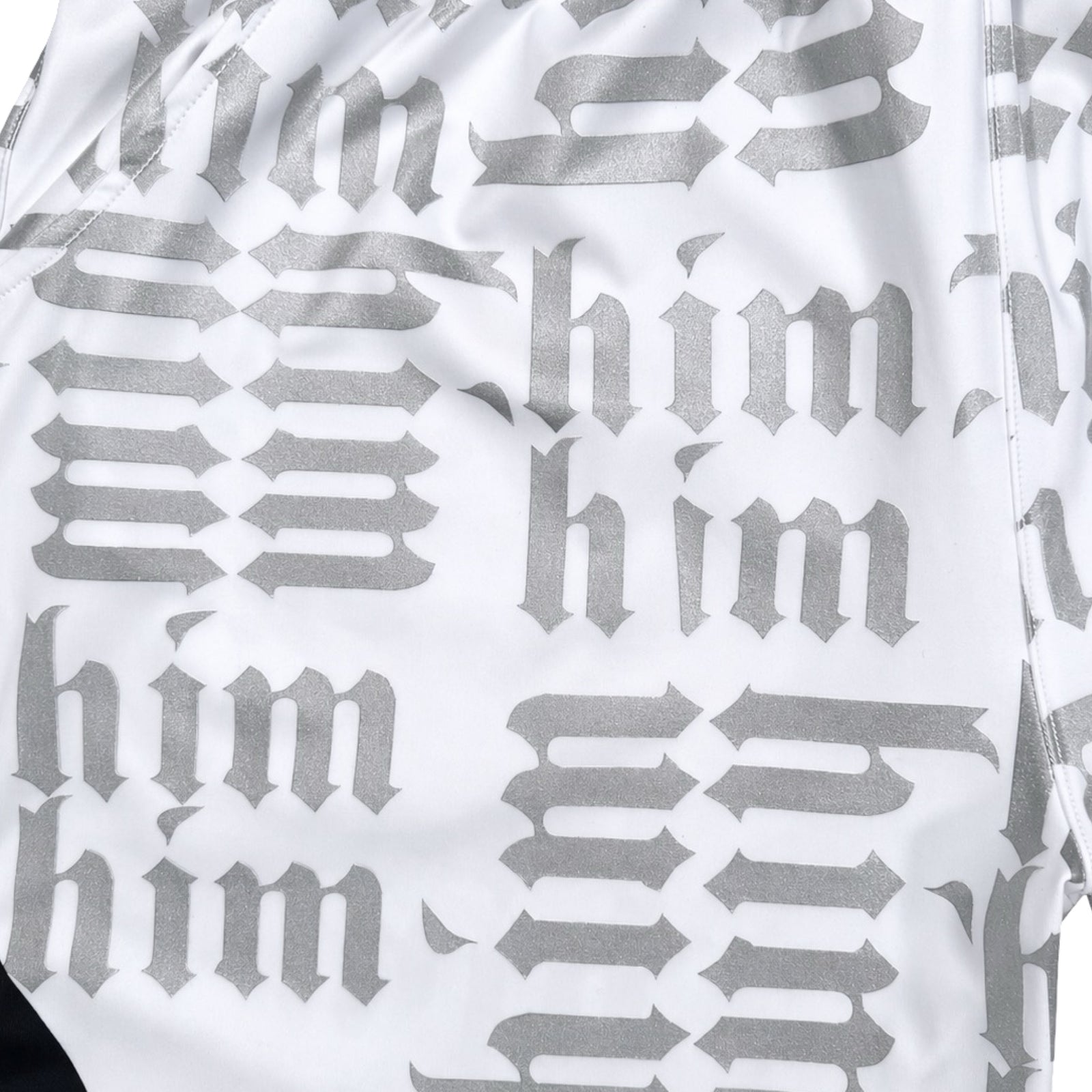 White silver and black him shorts with silver text pattern and black trim closeup