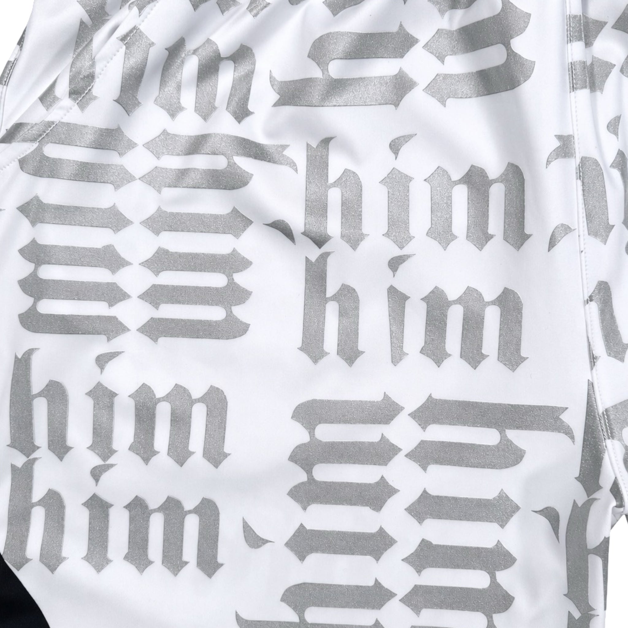 White silver and black him shorts with silver text pattern and black trim closeup
