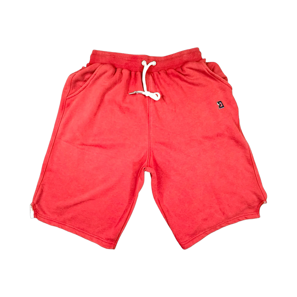 TRAPN™ Red Acid OFF COURT™ 390 GSM heavyweight Loopback Terry™ joggers with washed red finish and relaxed below-the-knee fit.