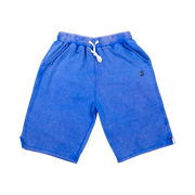TRAPN™ Blue Acid OFF COURT™ 390 GSM Loopback Terry™ joggers with washed blue finish, relaxed below-the-knee fit and TRAPN™ logo.