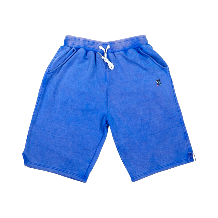 TRAPN™ Blue Acid OFF COURT™ 390 GSM Loopback Terry™ joggers with washed blue finish, relaxed below-the-knee fit and TRAPN™ logo.
