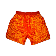 Mamba Elite PRO™ orange basketball shorts featuring a bold snakeskin-inspired pattern, premium MeshX™ construction, oversized PRO waistband, and performance athletic fit designed to match Kobe and Jordan sneakers.