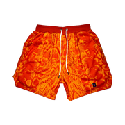 Mamba Elite PRO™ orange basketball shorts featuring a bold snakeskin-inspired pattern, premium MeshX™ construction, oversized PRO waistband, and performance athletic fit designed to match Kobe and Jordan sneakers.