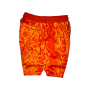 Mamba Elite PRO™ orange basketball shorts featuring a bold snakeskin-inspired pattern, premium MeshX™ construction, oversized PRO waistband, and performance athletic fit designed to match Kobe and Jordan sneakers.