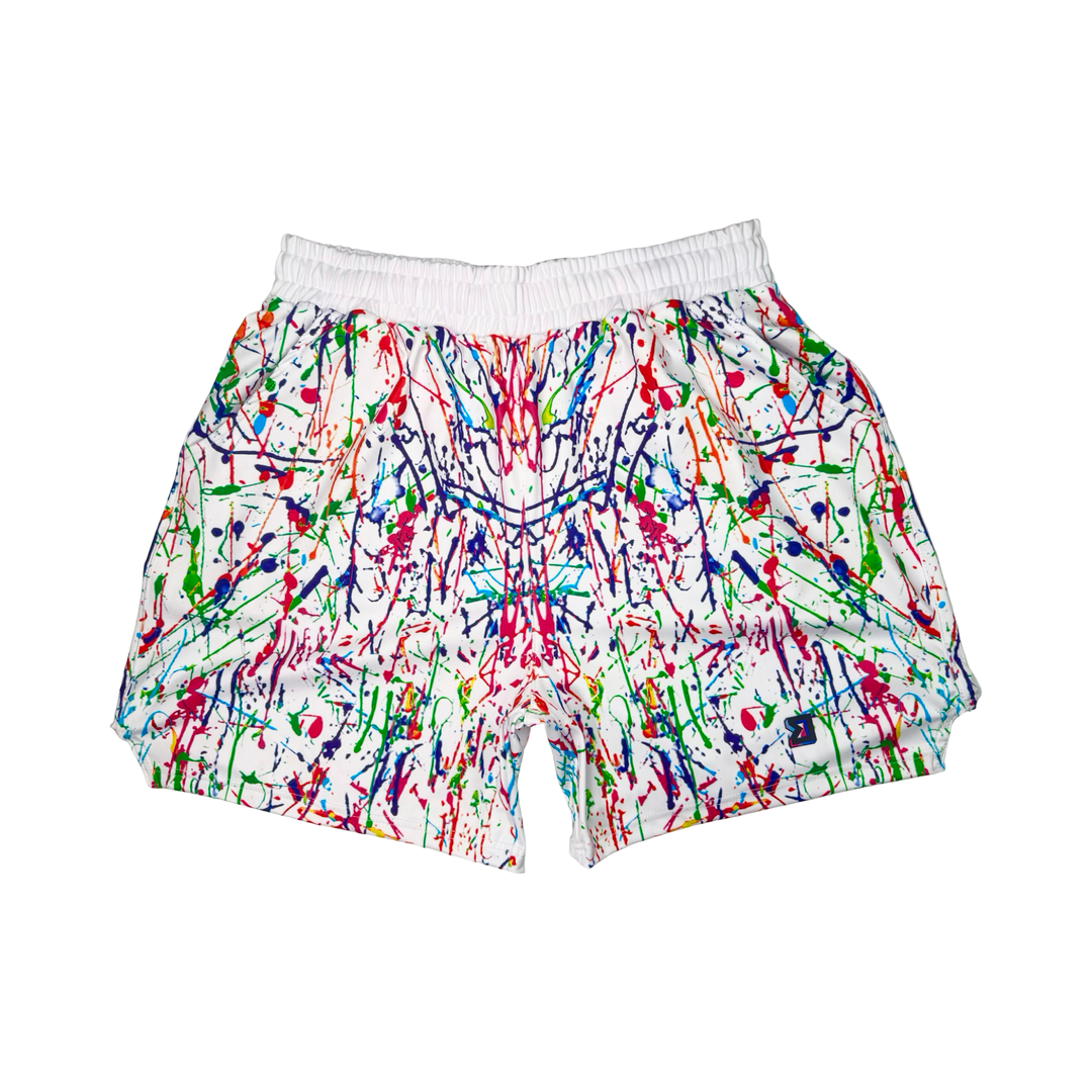 Colorful splatter paint shorts on a white background