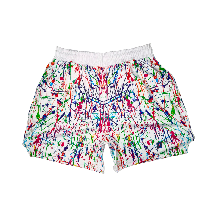 Colorful splatter paint shorts on a white background