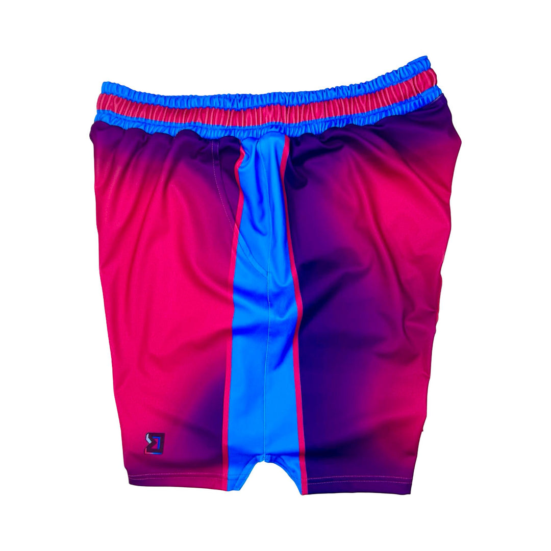 Pink and blue shorts with a visible brand logo on a white background