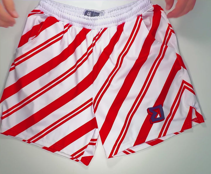 StripeOut Red Soft Quick-Dry basketball shorts with white base and red diagonal stripe pattern by Trap’N Shorts.