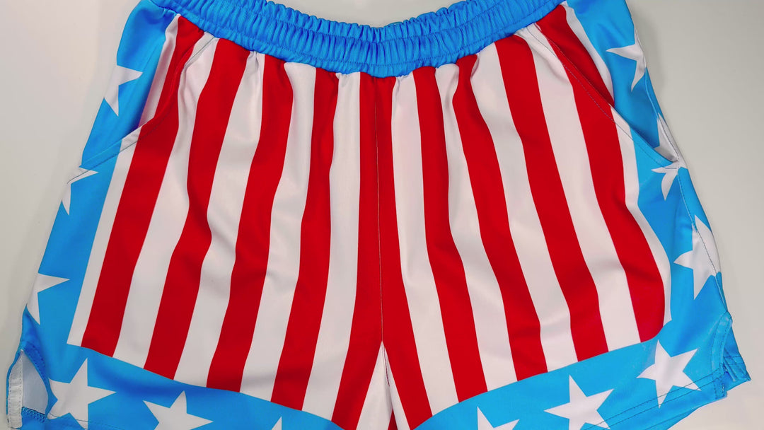Apollo Sky Soft Quick-Dry basketball shorts with red-white stripes and blue star borders inspired by vintage patriotic sports aesthetics by Trap’N Shorts.
