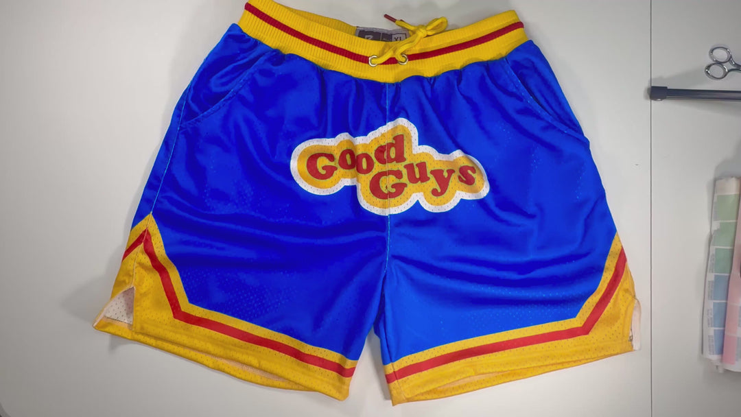 Good Guys Mesh Pro basketball shorts with retro blue–yellow colorway, zippered back pocket, and thick pro waistband by Trap’N Shorts.