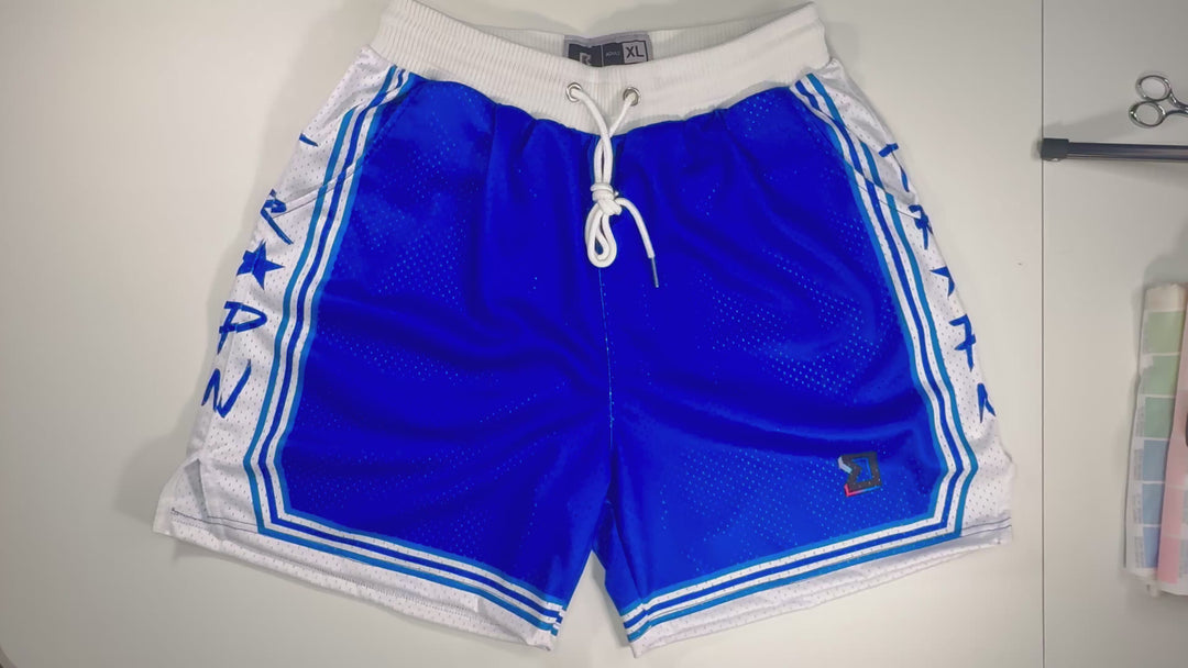 Trap Show Mesh Pro basketball shorts in vintage Minneapolis Lakers blue and white with pro waistband, side lettering, and stripe detailing by Trap’N Shorts.