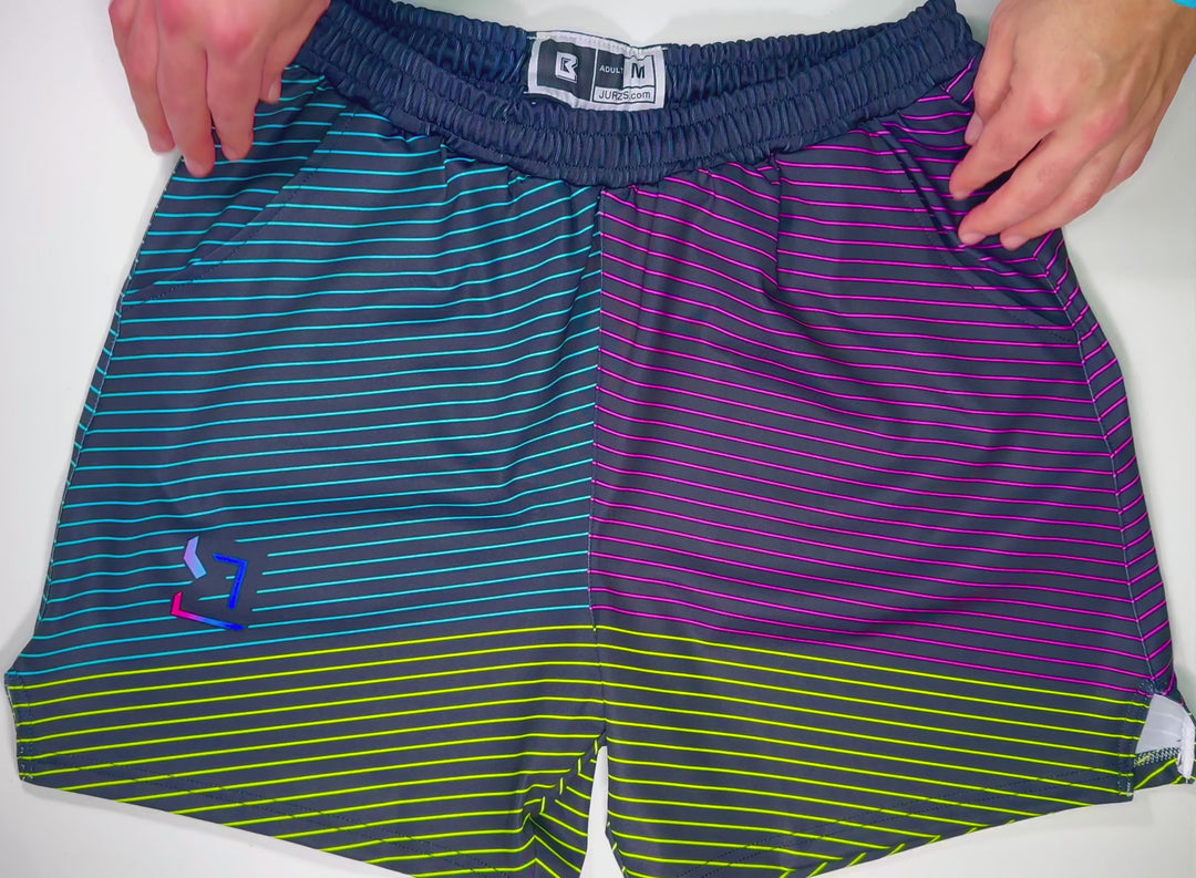 Headroom Soft Quick-Dry basketball shorts with retro split-gradient stripes in teal, purple, and neon accents by Trap’N Shorts.