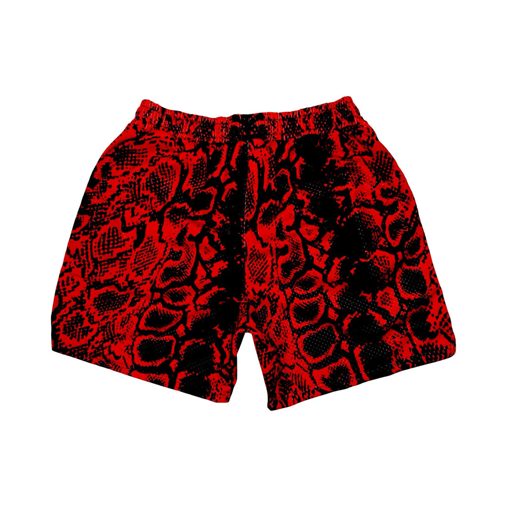 Red and black snakeskin patterned mesh shorts on a white background