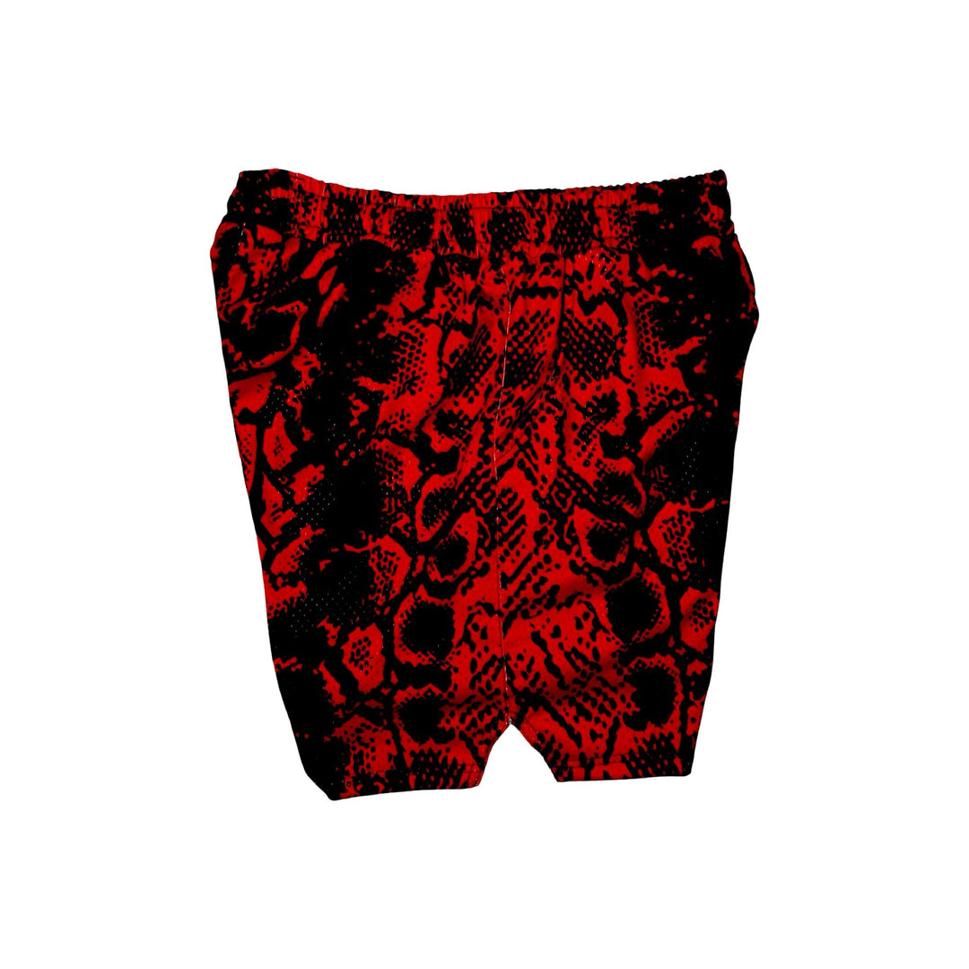 Red and black snakeskin patterned mesh shorts on a white background