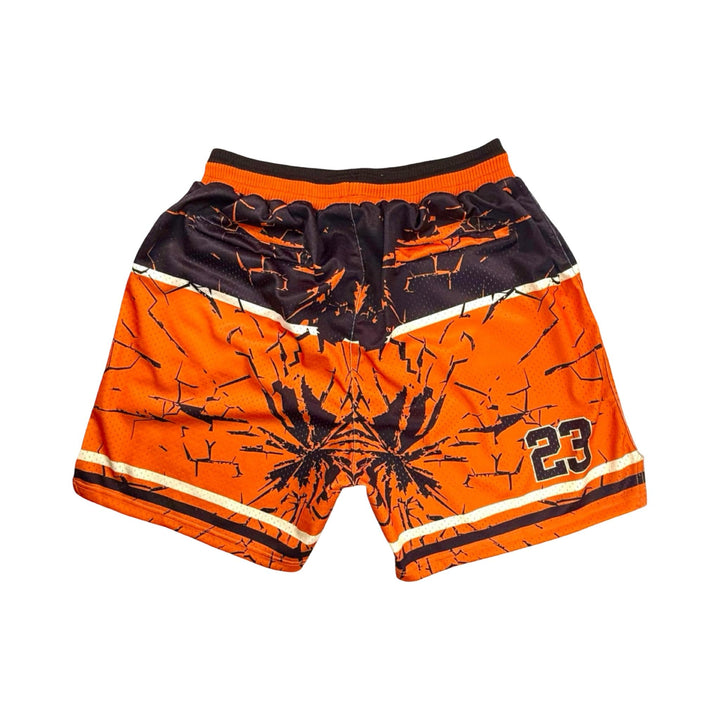 Orange and black shorts with a design and number 23 on a white background