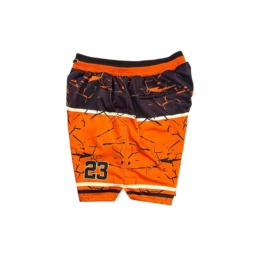 Orange and black shorts with a pattern on a white background
