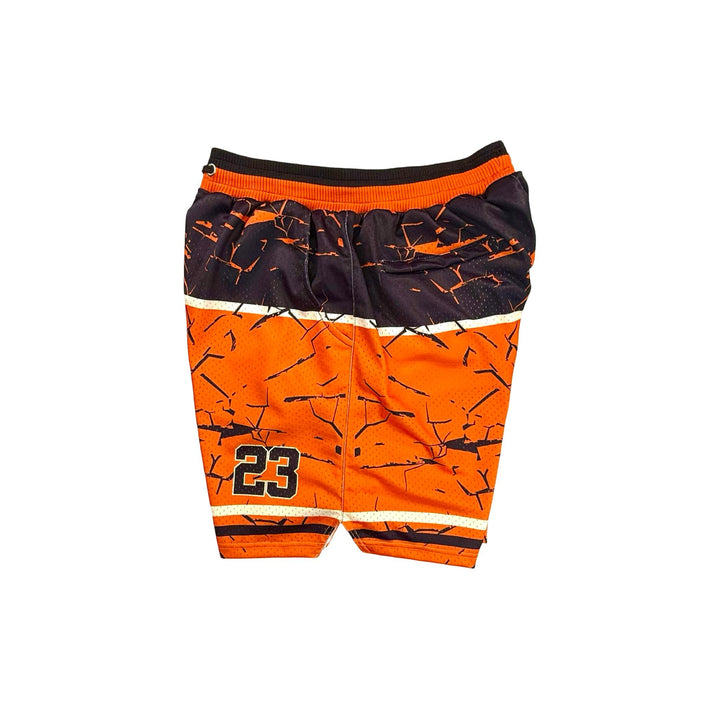Orange and black shorts with a pattern on a white background