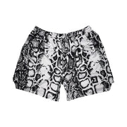 Snake print shorts on a white background
