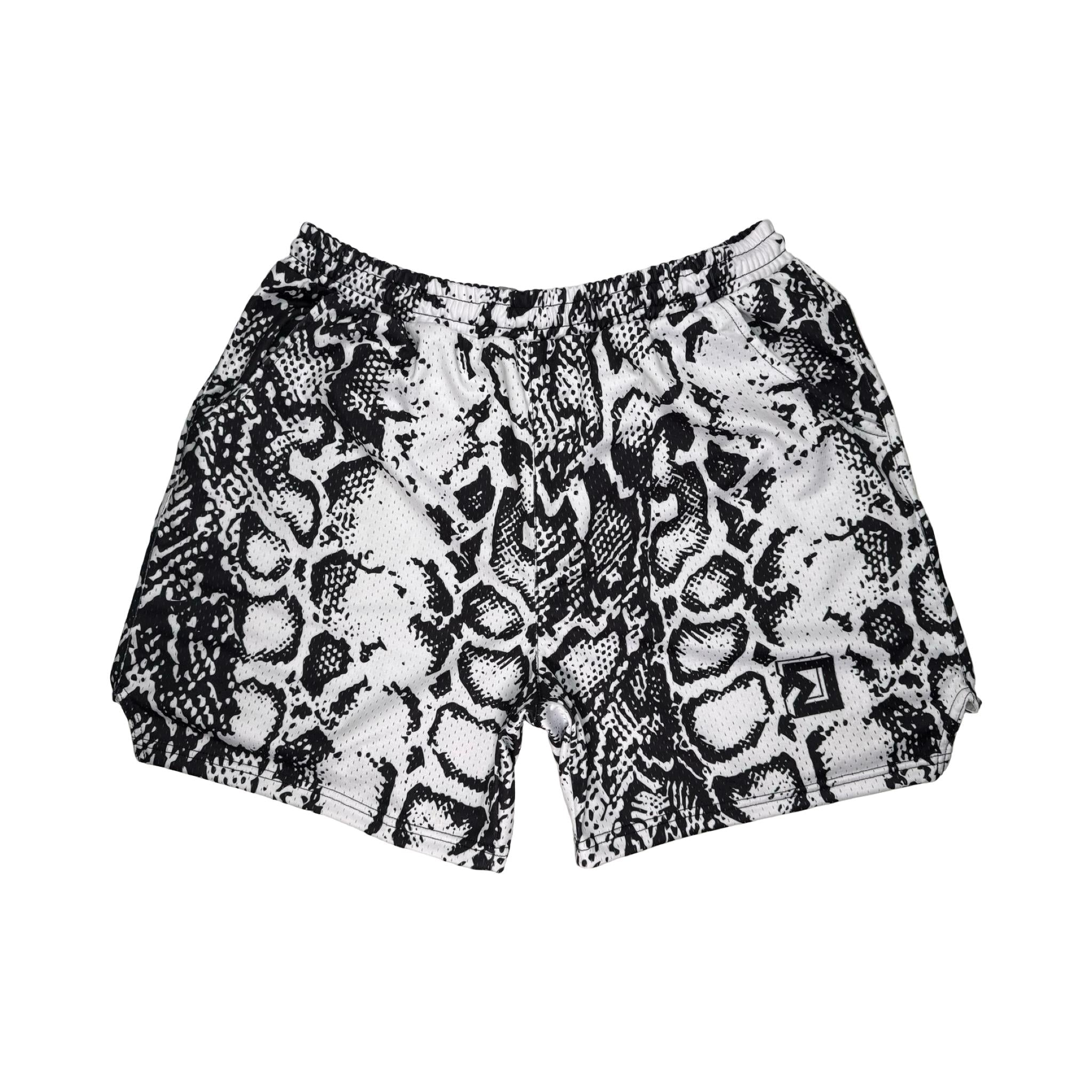 Snake print shorts on a white background
