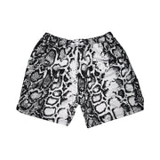 Snake print shorts on a white background