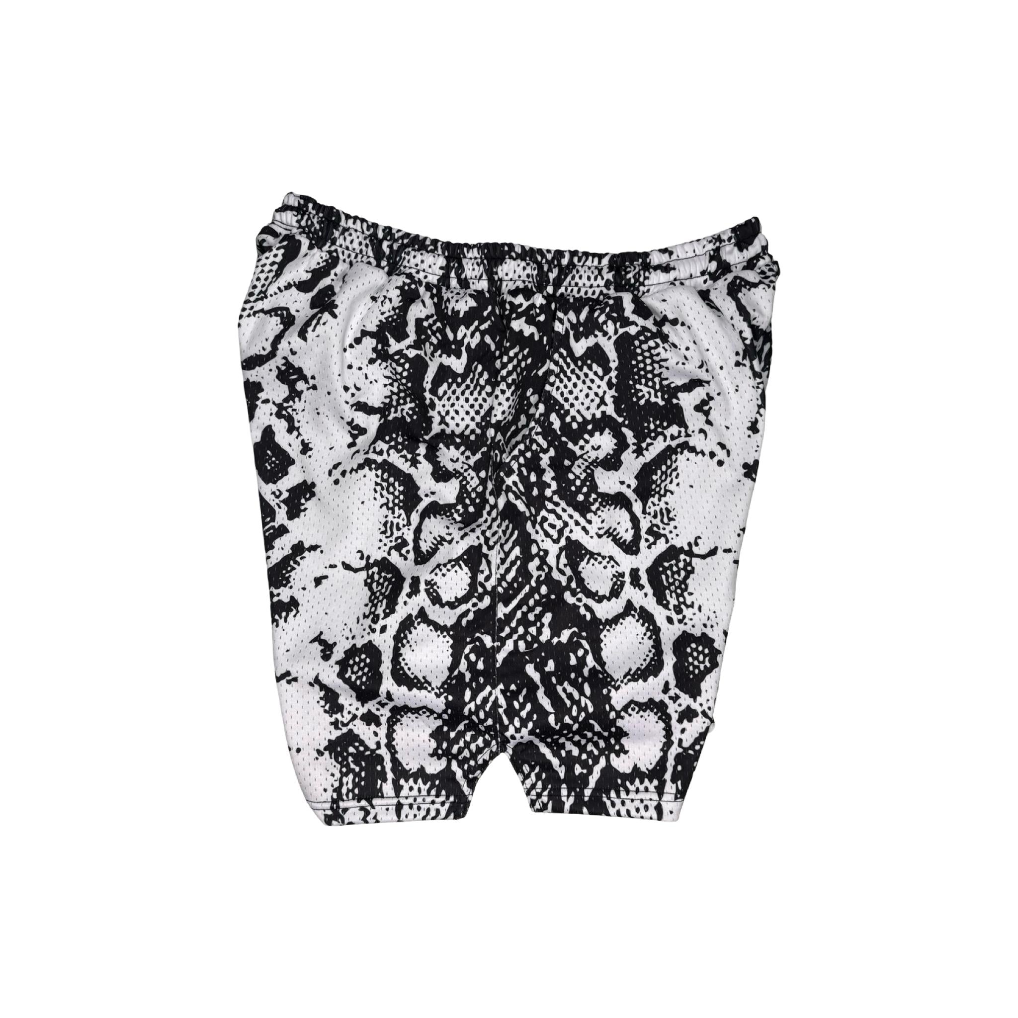 Black and white snake print shorts on a white background