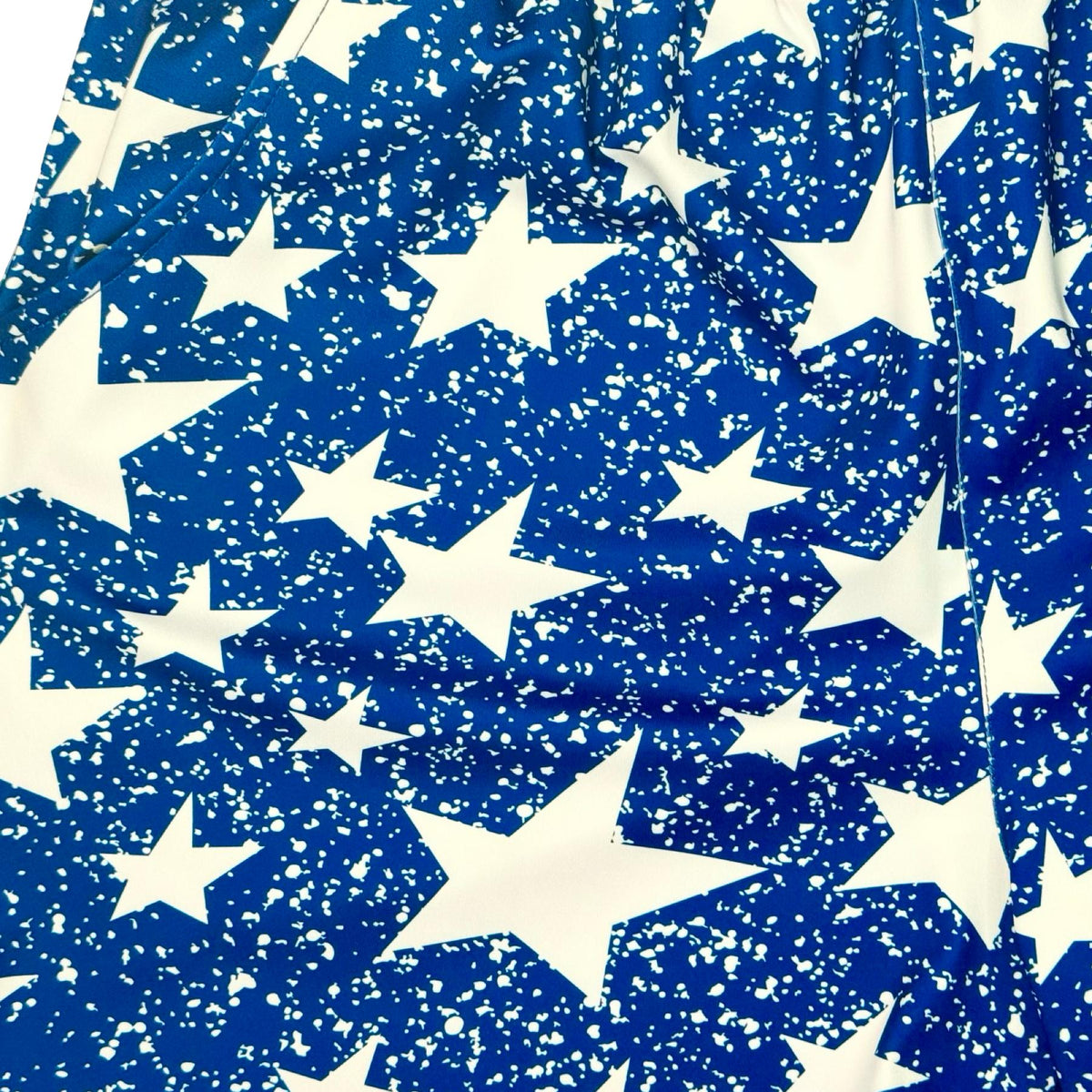 Navy blue smooth dry fit shorts with white star snow pattern close up texture 