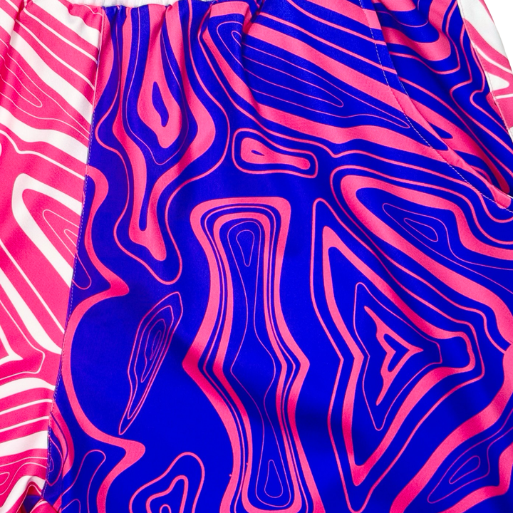 Fabric with a vibrant pink and blue abstract pattern