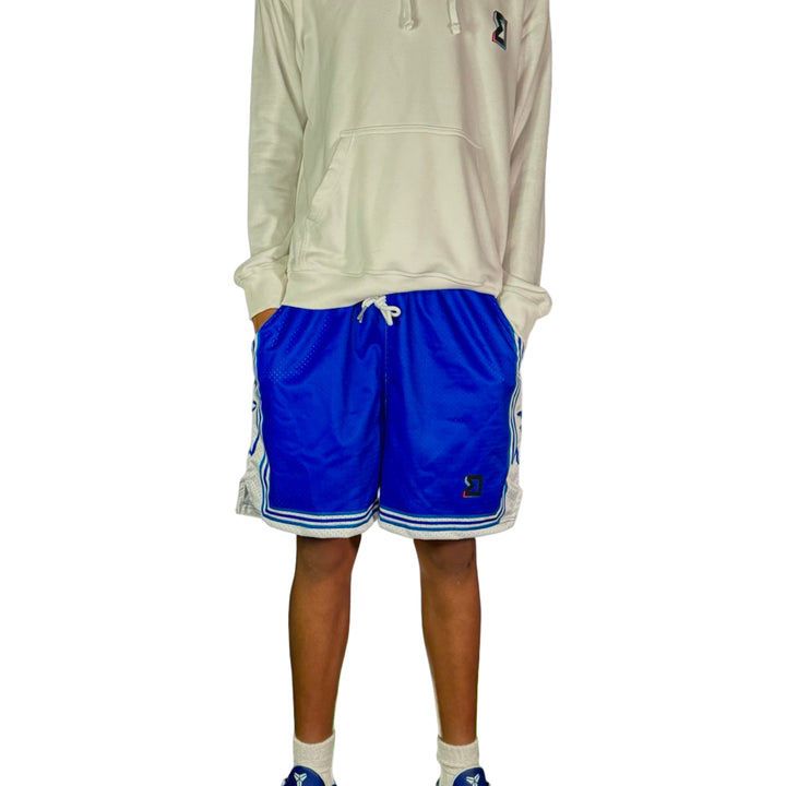 Person wearing a white hoodie and blue shorts