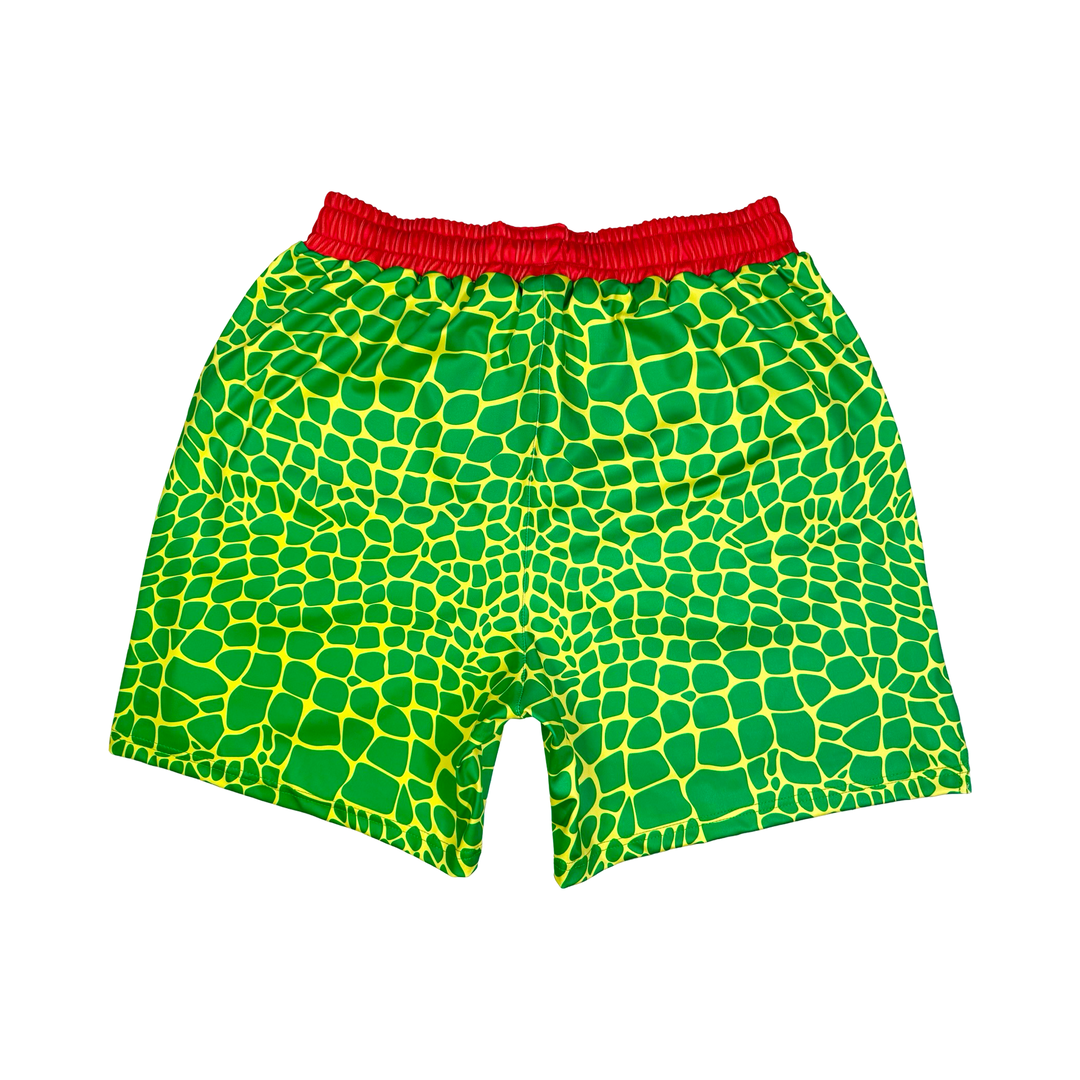 Trap Zombie Soft Quick-Dry basketball shorts in green reptile-scale pattern with red waistband, above-knee cut, and signature Trap’N Shorts logo.