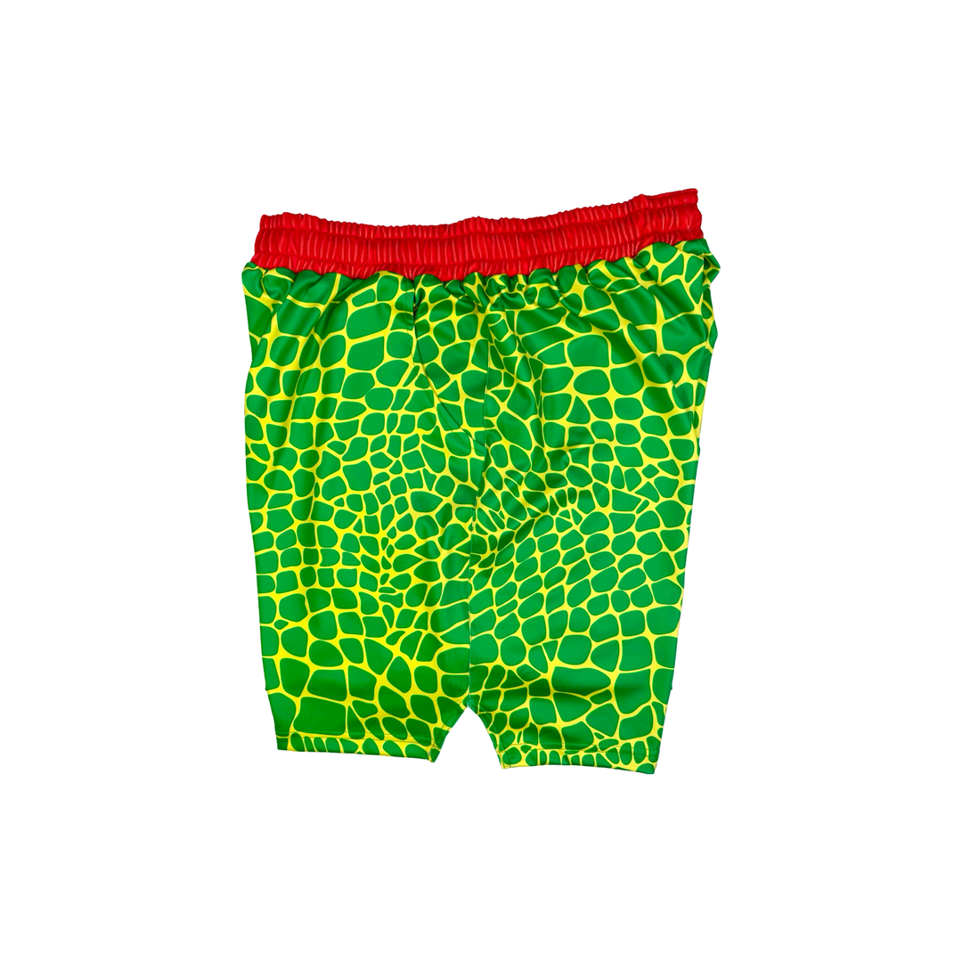 Trap Zombie Soft Quick-Dry basketball shorts in green reptile-scale pattern with red waistband, above-knee cut, and signature Trap’N Shorts logo.