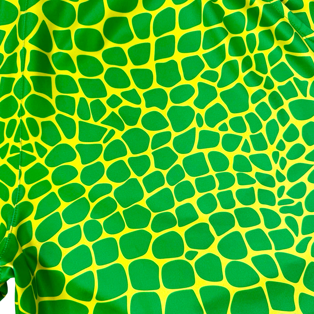 Trap Zombie Soft Quick-Dry basketball shorts in green reptile-scale pattern with red waistband, above-knee cut, and signature Trap’N Shorts logo.