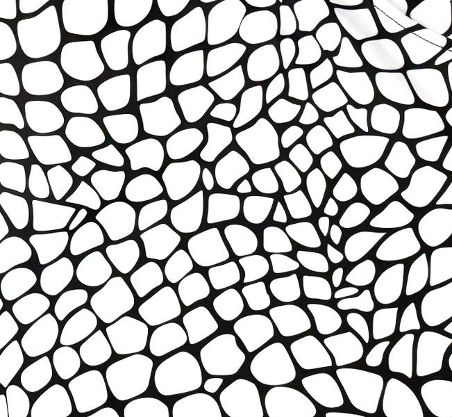 White and black gator/zombie patterned smooth dry fit shorts texture close up